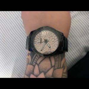 Black and gold Fossil watch